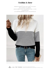 Detail of soft knit texture on this color-block striped long sleeve crewneck sweater