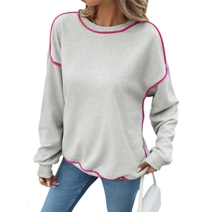 Loose fit light grey women's sweatshirt with vibrant pink contrast stitching and crew neck