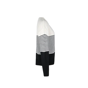 Detailed side view of black and white color-block striped knit sweater with round neck
