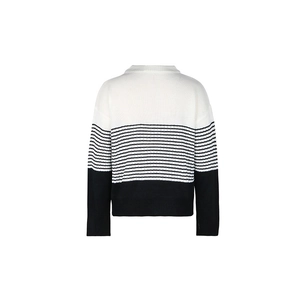 Detail view of the back of a black and white striped long sleeve knitted sweater top