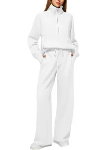 Detail of white two-piece tracksuit with half-zip sweatshirt and drawstring wide-leg pants