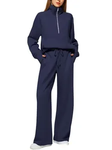 Close-up of a navy blue two-piece sports set with half-zip hoodie and drawstring wide-leg pants