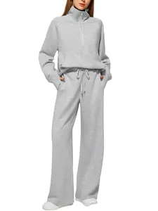 Detail of grey half-zip sweatshirt and wide-leg jogger set with drawstring waist