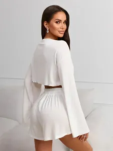 Detail of white waffle texture lounge set with flared sleeves and drawstring shorts