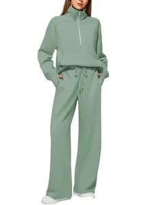Detail view of green quarter-zip sweatshirt and matching straight-leg pants set