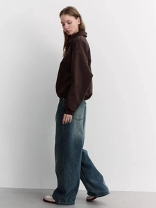Minimalist chocolate brown polo collar sweatshirt paired with light wash wide leg jeans