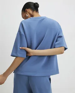 Detail view of smog blue two-piece set featuring dropped shoulders and wide hem design