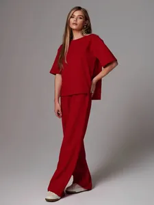 Full view of women's red two-piece casual set featuring crewneck top and wide-leg pants