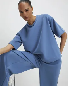 Detail of blue two-piece set showing soft fabric texture and casual wide-leg pants fit