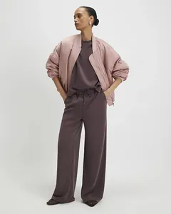 Women's pink satin bomber jacket paired with a purple drawstring long pants two-piece set