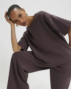 Close-up of high-quality dark purple modal fabric with smooth texture and draped design