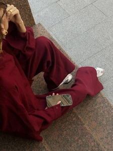 Deep red cotton two-piece set featuring loose long-sleeve shirt and high-waisted trousers