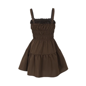 Detailed back view of brown tiered mini dress with elastic smocking and adjustable straps