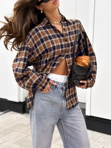 Classic loose plaid shirt in brown and navy blue styled with high waist grey jeans