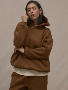 Detail of premium caramel brown hoodie and matching jogger set fabric texture