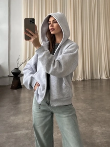 Women's loose grey zip-up hoodie with drop shoulders and casual minimalist design