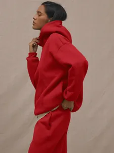 Detail of red hooded tracksuit with soft cotton texture and casual sporty silhouette