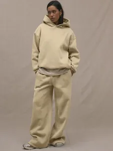 Close-up of beige hooded sweatshirt with dropped shoulders and matching wide-leg pants