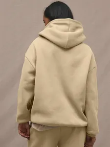 Back view of beige hooded tracksuit showing relaxed drop shoulder and soft fleece texture