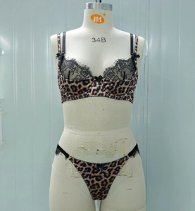 Close-up of leopard print bra with black eyelash lace trim and adjustable straps