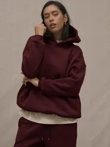 Detail of oversized wine red hoodie set showing heavy cotton fabric and drop shoulder design