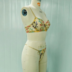 Sheer mesh floral embroidery lingerie set with underwire bra and thong on mannequin