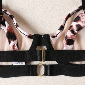 Leopard print lingerie set back detail with gold rings and black straps on mesh fabric