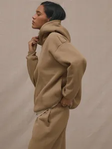 Detail view of earth tone oversized hoodie and matching joggers set in soft cotton fabric