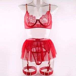 Detailed view of red lace lingerie set featuring gold chain straps and sheer mesh skirt