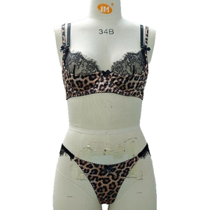 Sexy leopard print lingerie set with black eyelash lace trim and bow accent on white mannequin