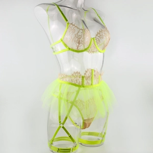 Detail view of neon yellow lace lingerie with steel underwire and mesh garter skirt