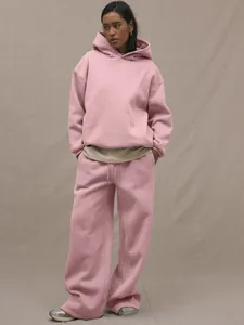 Detail of pink heavy cotton oversized hoodie and wide-leg joggers lounge set