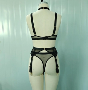Detail view of the black mesh lingerie set back straps and garter belt with metal clips
