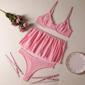 Pink sheer mesh lingerie set with underwire bra and ruffled skirt on white background