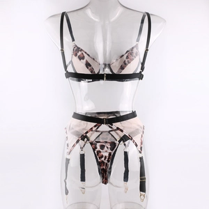 Detailed close-up of leopard print lingerie set featuring bra, garter belt, and thong
