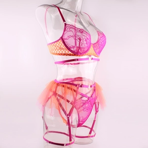 Detailed lace embroidery and orange mesh skirt detail on sexy three-piece lingerie set