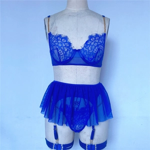 Detailed view of royal blue lace lingerie set with gold chain straps and garter straps