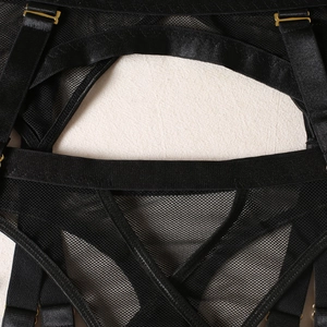 Detail of black mesh lingerie with premium gold metal adjusters and elastic straps
