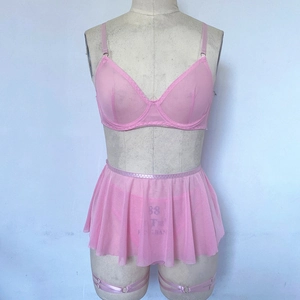 Detailed view of pink mesh lingerie set with wired bra and sheer pleated mini skirt