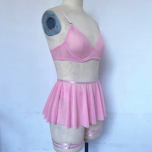 Detailed view of pink sheer mesh lingerie set featuring underwire bra and ruffled skirt trim