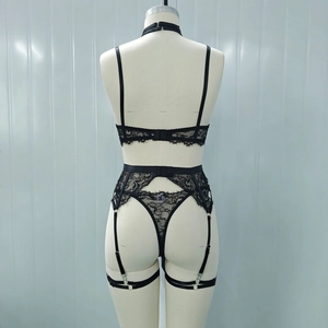 Detail of black floral lace lingerie set back view with adjustable straps and garters