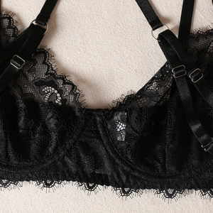 Detail of delicate eyelash lace and adjustable elastic straps with silver metal rings