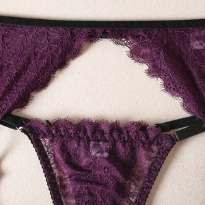 Close-up of deep purple eyelash lace lingerie set featuring black elastic straps and metal rings