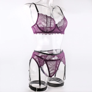 Detailed view of purple lace lingerie set with underwire bra and garter belt on mannequin