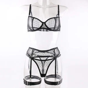 Detail of black polka dot mesh lingerie set with underwired bra and adjustable garters