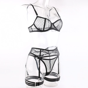 Detailed view of the sheer black polka dot mesh lingerie set with garter belt and thong