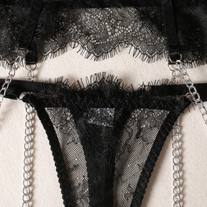 Close-up of black eyelash lace lingerie set featuring silver metal chains and ring details
