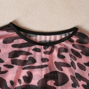 Close-up of pink leopard print mesh top showing breathable fabric and neckline detail