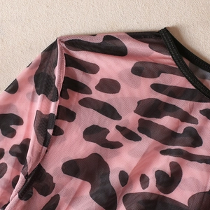 Detail of pink leopard print mesh top showing breathable fabric and stitching quality