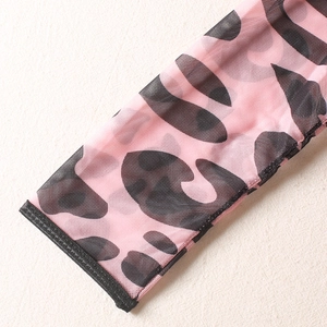 Detail of pink leopard print mesh sleeve with high-quality black stitched cuffs